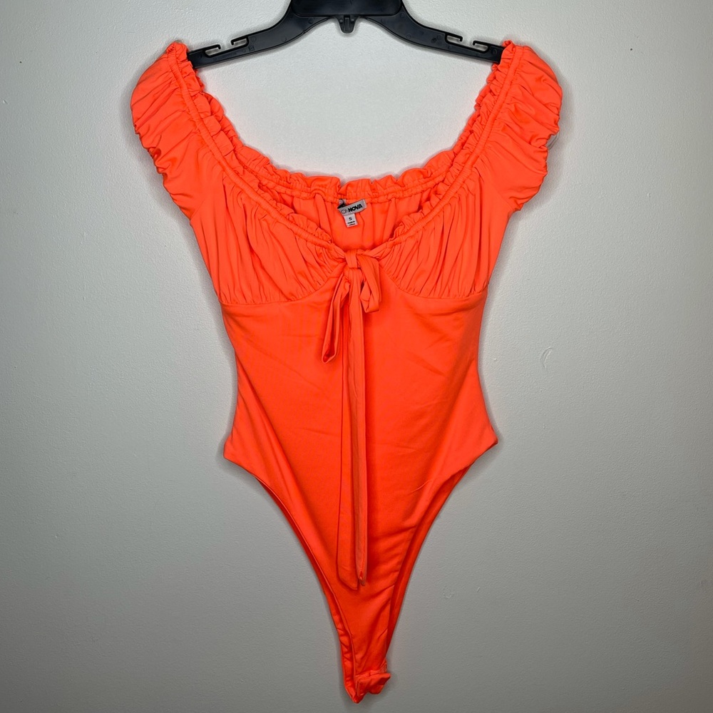 Neon orange body suit with bow tie